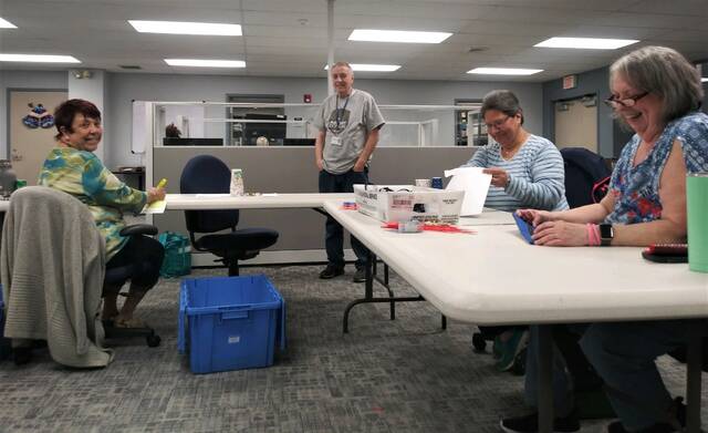 <p>Luzerne County Election Board member Danny Schramm watches as county employees check in polling place returns at the county election bureau Tuesday night. From left are workers Kathryne Wood, Maria Kishbaugh and Carol Dulaney.</p>
<p>Jennifer Learn-Andes | Times Leader</p>