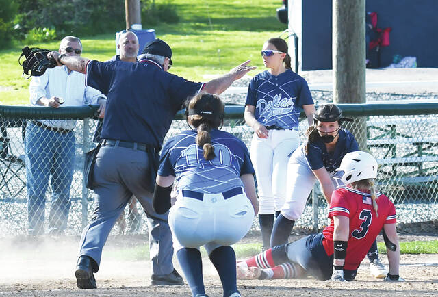 <p>Home plate umpire Lou Lussi calls Pittston Area’s Skylar Borthwick safe as she slide under the tag at third base.</p>
<p>Tony Callaio | For Sunday Dispatch</p>