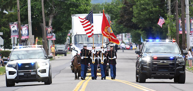 128578863_web1_WP-Exeter-Memorial-Day-Parade-1--1-
The Marines along with the West Pittston cruiser, left, and the Exeter cruiser, right, led the annual Memorial Day Parade on Monday.
Tony Callaio | For Sunday Dispatch