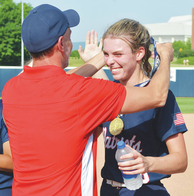 <p>Patriots pitcher Gianna Adams receives her state gold medal from coach Frank Parente after she threw a two-hit shutout to win Thursday’s state title game.</p>
<p>Tony Callaio | For Sunday Dispatch</p>