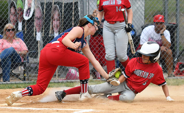 128687182_web1_PA-GSB-8-10-Mt-Top-Final-1
Moutain Tops Bryn Grobelny (5) is tagged out at the plate by PA Softballs pitcher Ainsley Lear.
Tony Callaio | For Sunday Dispatch