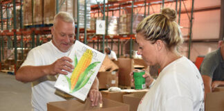 
			
				                                Leo Malsky and Cassandra Coleman, America250PA executive director, pack cereal in boxes before sending the box down the assembly line.
                                 Tony Callaio | For Sunday Dispatch

			
		