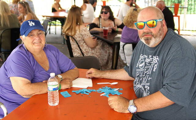 <p>Mary Marranca and her son, Anthony, the founder of the Greater Pittston Santa Squad, take a breather during Christmas in July at the Susquehanna Brewing Co.</p>
<p>Tony Callaio | For Sunday Dispatch</p>