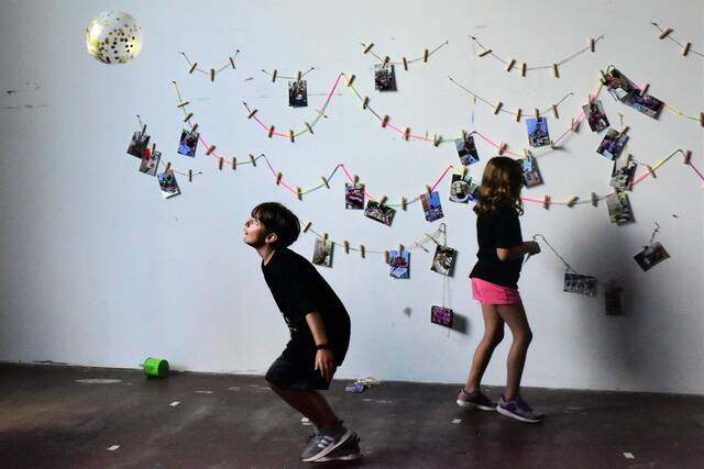 <p>Near the end of a reception held in conjunction with an Arts in Motion Showcase, 8-year-old Cooper Morgan of Forty Fort amuses himself by keeping a balloon aloft.</p>
<p>Mark Guydish | Times Leader</p>