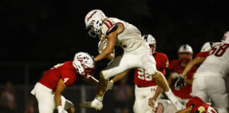 
			
				                                Hazleton Areas Matthew Buchman jumps over a player on his way to a touchdown on Friday night.
                                 Fred Adams | For Sunday Dispatch

			
		