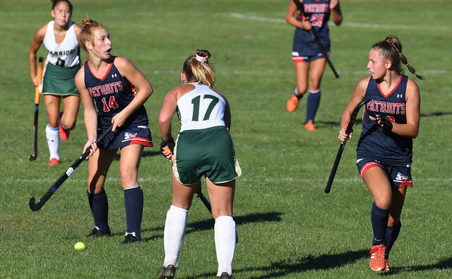 <p>The Patriots’ Maddie Karp (14) looks down field to pass the ball during the game with rivals Wyoming Area. </p>
<p>Tony Callaio | For Sunday Dispatch</p>