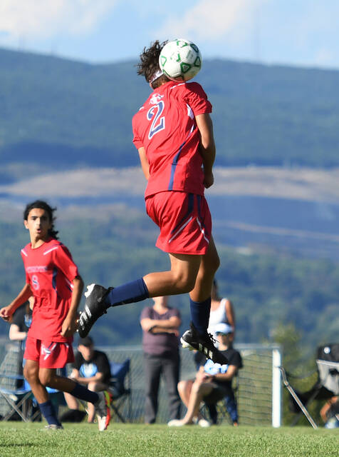<p>Senior Peter Zawierucha gets up high in an attempt to hit a header in a home game against Greater Wilkes-Barre Area on Aug. 31.</p>
<p>Tony Callaio | For Sunday Dispatch</p>