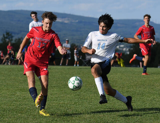 <p>Pittston Area’s William Egan (17) and the Wolfpack’s joaquin Prad (14) race for possesion of the ball.</p>
<p>Tony Callaio | For Sunday Dispatch</p>