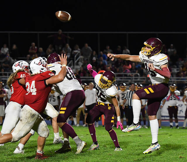 <p>Pittston Area pass rushers Dave Sudo (34) and John Barchi-Crich (40) put pressure on Spartans quarterback Lucas Zdancewicz (15).</p>
<p>Tony Callaio | For Times Leader</p>