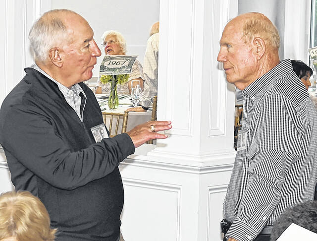 <p>Phil Fogli, Class of ‘62, chats with classmate Carl Rosencrance prior to dinner.</p>
<p>Tony Callaio | For Sunday Dispatch</p>