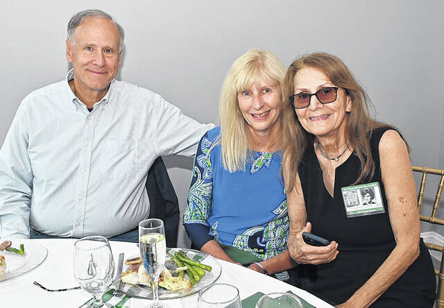 <p>West Pittston school attendee, Robert Seeley, Class of ‘73, left, his wife Janis, center, and 1963 West Pittston H.S. graduate Michelle Hastie Mendelshon, catch up after dinner at The Banks, Pittston.</p>
<p>Tony Callaio | For Sunday Dispatch</p>