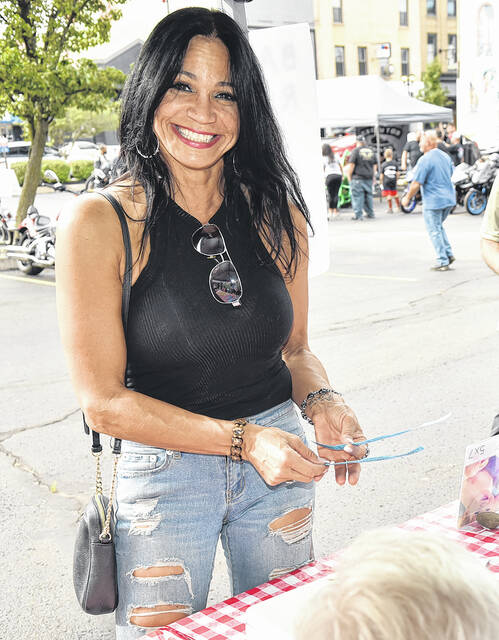 <p>Jenise Pundar, of Old Forge, is shown purchasing raffle tickets during the Wheels for Meals Bike Night & BBQ to benefit Pittston Meals on Wheels.</p>
<p>Tony Callaio | For Sunday Dispatch</p>