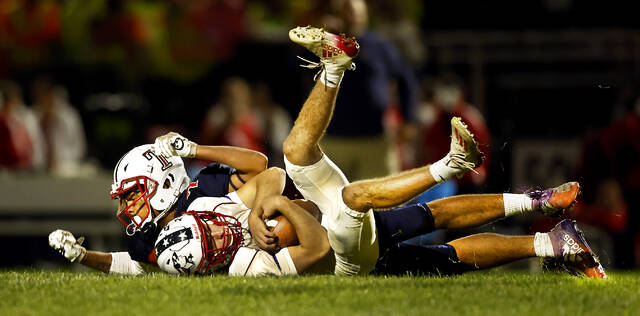 <p>Nanticoke Area defensive lineman Jaidyn Johnson sacks Pittston Area quarterback Drew DeLucca during the second quarter on Friday.</p>
<p>Fred Adams | For Times Leader</p>