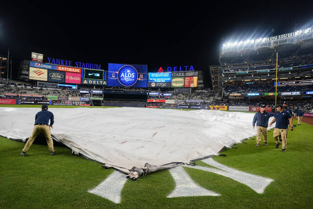 128997009_web1_128997009-683ff380b55644f0970ad84381698dd0
The Yankee Stadium grounds crew pulls the rain tarp over the field during a rain delay before Game 5 of an American League Division Series between the New York Yankees and the Cleveland Guardians on Monday in New York.
AP photo