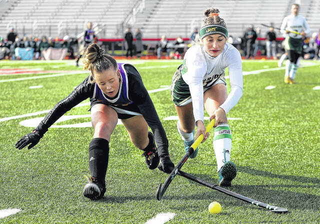<p>Wyoming Area’s Alexys Moore and Boiling Springs’ Kate Yenser try to keep the ball in play as it rolls toward the sideline in the first half of play in the PIAA Class A field hockey championship game on Saturday in Mechanicsburg.</p>
<p>Fred Adams | For Sunday Dispatch</p>