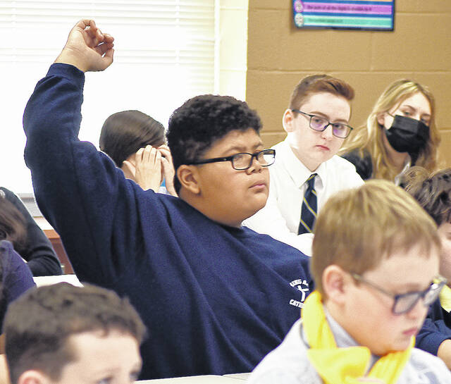 <p>Seventh grade student at Wyoming Area Catholic, James Chromey, had a question for Alan Stout, writer and producer of the documentary Agnes: 50th Anniversary.</p>
<p>Tony Callaio | For Sunday Dispatch</p>