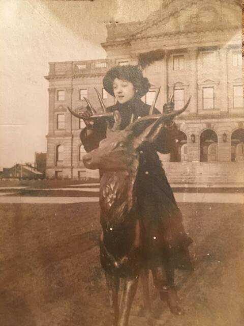 129227612_web1_1910-Marie-Riester--oldest-photo-so-far
1910: Marie Riester poises on the County Courthouse deer. This is the oldestknown photo of the statue.