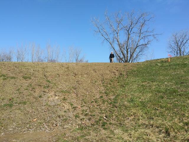 <p>Luzerne County Flood Protection Authority Executive Director Christopher Belleman stands atop a section of the levee that once contained a large opening for a railroad line that no longer operates off Swetland Lane in Wyoming.</p>
<p>Jennifer Learn-Andes | Times Leader</p>