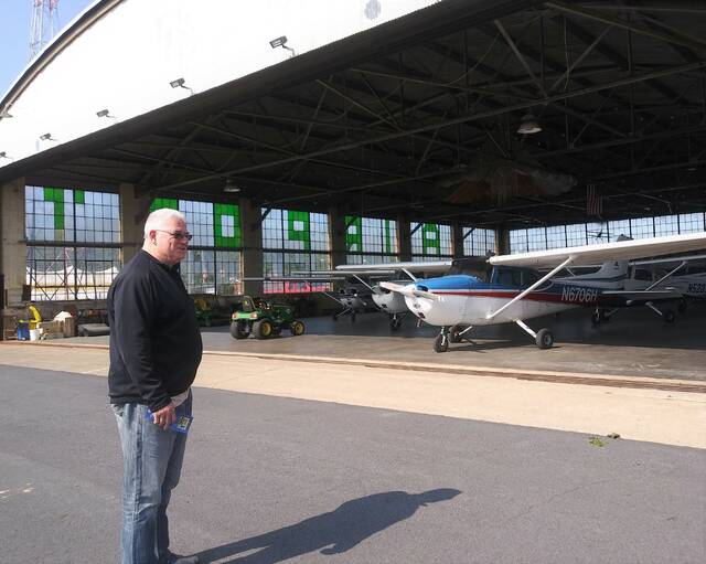 <p>Luzerne County Councilman Brian Thornton checks out a 1929 building at the county-owned Wyoming Valley Airport that is still in active use and appreciated for its historical value.</p>
<p>Jennifer Learn-Andes|Times Leader</p>