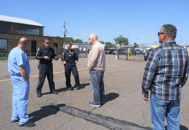 <p>A medevac crew (dressed in black) discusses the convenience of fueling their helicopter at the Luzerne County-owned Wyoming Valley Airport with, from left, Dr. Charles Scrobola, a representative of facility fixed-base operator Valley Aviation; and county Council members Brian Thornton and Kevin Lescavage.</p>
<p>Jennifer Learn-Andes|Times Leader</p>