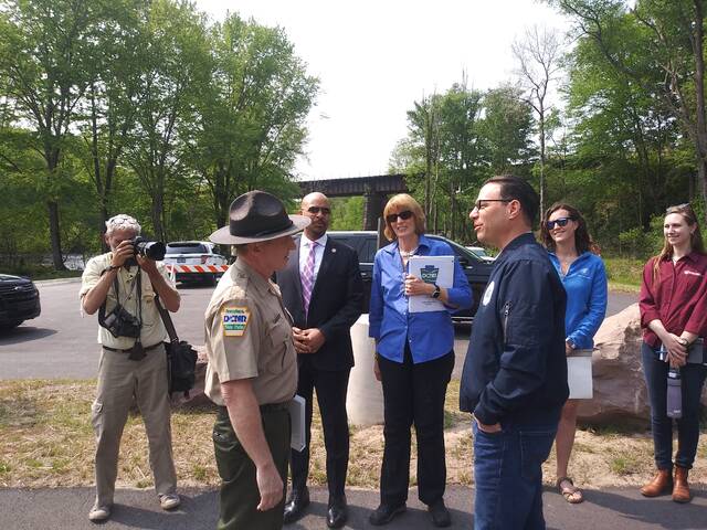 129674349_web1_shapiro3
Pennsylvania State Parks Director John Hallas, front left, greets Pennsylvania Gov. Josh Shapiro Wednesday during the opening of a new Lehigh Gorge State Park public access area near Interstate 80 in White Haven.
Jennifer Learn-Andes | Times Leader