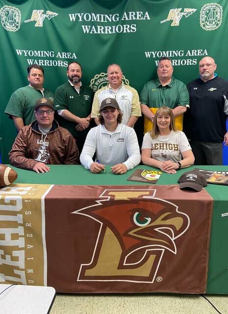 129684592_web1_MarrancaSigning--1-
Wyoming Area senior tight end/linebacker Joey Marranca recently signed an NCAA Letter of Intent to play football at Lehigh University. Seated, from left: Carm Marranca, father; Joey Marranca; and Sharon Marranca, mother. Standings, same order: Mike Fanti, assistant coach; Joe Pizano, athletic director/assistant coach; Randy Spencer, head coach; Eric Speece, principa
Submitted Photo