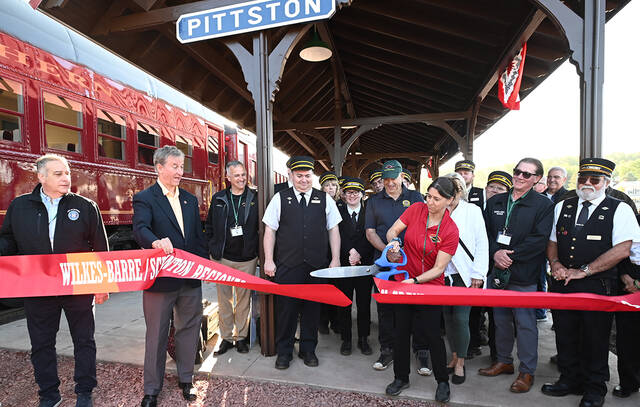 129685187_web1_Pittston-Jim-Thorpe-inaugural-5
Christina Muller Levan, Reading & Northern executive vice president-strategic planning, did the honors of cutting the ribbon for the inaugural Pittston to Jim Thorpe excursion on Saturday.
Tony Callaio | For Times Leader