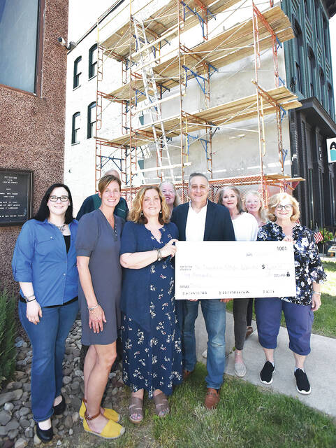 129701236_web1_Pittston-Ah-Baby-Mural
Pittston Arts Council recently donated $6,000 towards the completion of the latest mural to be installed in the City of Pittston located on the side of the Ah Baby & Co. building. Shown in the photo are, front row, left to right: Sheena Dalley, Arts Council, Mary Kroptavich, Main Street mgr., Judy Greenwald, Arts Council president, Pittston City Mayor Michael Lombardo, Karen Stocknick, Arts Council, Piera Marotto, Arts Council VP. Back row: Bob Price, Arts Council (hidden), Erin Ostrowski, Arts Council, Caroline Nelson, Ah Baby & Co. building owner.
Tony Callaio | For Sunday Dispatch