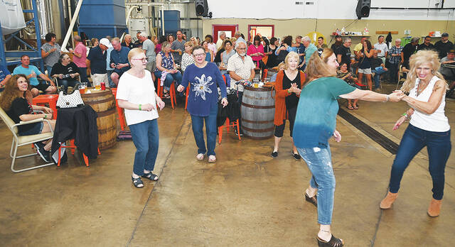 <p>Close to 300 people attended Christmas in July by the Greater Pittston Santa Squad. Attendees were both inside listening to live music or outside under a huge tent.</p>
<p>Tony Callaio | For Sunday Dispatch</p>