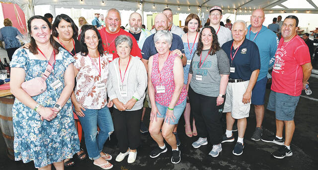 <p>The Greater Pittston Santa Squad (GPSS) held the 3rd Annual Christmas in July at the Susquehanna Brewing Co. on Sunday, July 9. Shown are members of the GPSS. Front row, left to right: Dana Klush, Charlene Krawchuk, Fran Granahan, Lisa Argenziano, Diana Worosilla, John Alaimo, Gary Worosilla. Back row: Denise Manganiello, Thomas Granahan, Anthony Marranca (founder), Todd Argenziano, Bob Breymier (far back), Sky Worosilla, Gray Knaub, Paul McGarry.</p>
<p>Tony Callaio | For Sunday Dispatch</p>