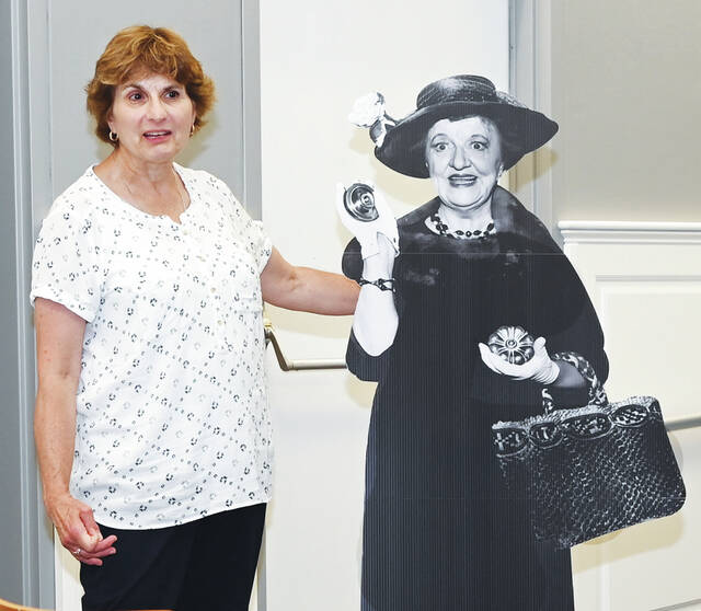 129876146_web1_Aunt-Clara-cutout
West Pittston Historical Society President Mary Portelli stands next to a cardboard cutout of Marion Lorne in her role as Aunt Clara from the TV show, Bewitched. The cutout of Marion has been placed in different locations in West Pittston. If you see Marion, take a photo of her and email it to westpittstonhistory@gmail.com along with the location of the cutout to be elegible for gift cards from area merchants.