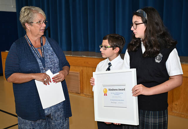 <p>Wyoming Area Catholic (WAC) Principal Eileen Rishcoff congratulates WAC students Evan and Emilia Janoski, on receiving the first-ever $500 award from the WAC Class of 1980’s Kindness Award in the memory of Anthony Ristagno, WAC ‘80.</p>
<p>Tony Callaio | For Sunday Dispatch</p>