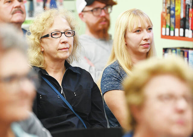 <p>Lynn Rachkowski, left, and her daughter Lauren, listen to West Pittston Library guest speaker Maxim W. Furek’s talk on the paranormal in NEPA.</p>
<p>Tony Callaio | For Times Leader</p>