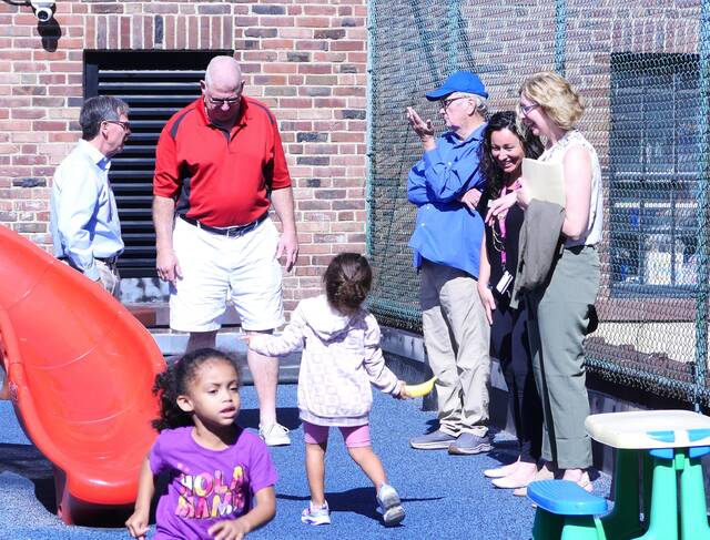 130037355_web1_ymca2-
Luzerne County Councilman Brian Thornton (in red shirt) strikes a playful pose as a child interacts with him Thursday at the Greater Wyoming Valley Area YMCA building in Wilkes-Barre. Others participating in the tour, from left, are Jim Thomas, the nonprofits chief executive officer, Councilman Tim McGinley, YMCA development director Lindsay Landis and county grant writer Michele Sparich.
Jennifer Learn-Andes | Times Leader