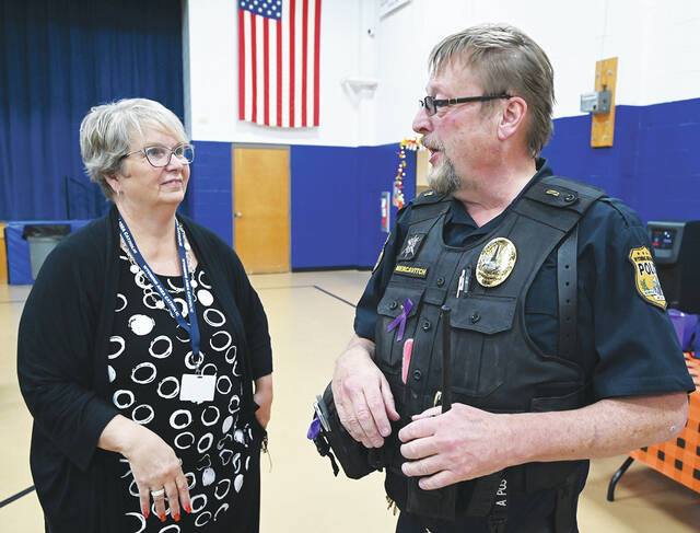 130078786_web1_WAC-Gives-Back-to-WARP-4
Wyoming Area Regional Police Lt. Chris Mercavitich chats with Wyoming Area Catholic Principal Eileen Rischoff.
Tony Callaio | For Sunday Dispatch