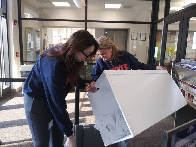 130126487_web1_election1
Mail ballots deposited at Luzerne Countys Penn Place drop box in downtown Wilkes-Barre are retrieved Tuesday afternoon by county Deputy Election Director Emily Cook, at left, and county Administrative Services Division Head Jennifer Pecora.
Jennifer Learn-Andes | Times Leader