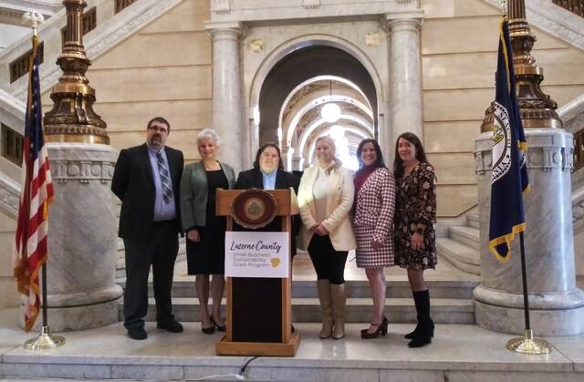 130147869_web1_chamber
Applications are now being accepted for a Small Business Sustainability Grant Program that Luzerne County Council funded with a $5 million federal American Rescue Plan allocation. Gathered in the county courthouse rotunda to announce the program Wednesday, from left, are: Matthew Bickert, Greater Wyoming Valley Chamber; Mary Malone, Greater Hazleton Chamber; county Manager Romilda Crocamo; Lindsay Griffin Boylan, Greater Wyoming Valley Chamber; Michelle Mikitish, Greater Pittston Chamber; and county Councilwoman LeeAnn McDermott.
Jennifer Learn-Andes|Times Leader