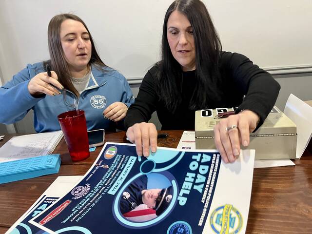 130315208_web1_IMG_3159
Clarissa Tarnowski, left, and Tricia Slusser work the raffle ticket table at Sundays benefit for wounded Scranton Police Detective Kyle Gilmartin held at The Knights in downtown Pittston. Gilmartin is a Luzerne County native who grew up in the Pittston area.
Roger DuPuis | Times Leader