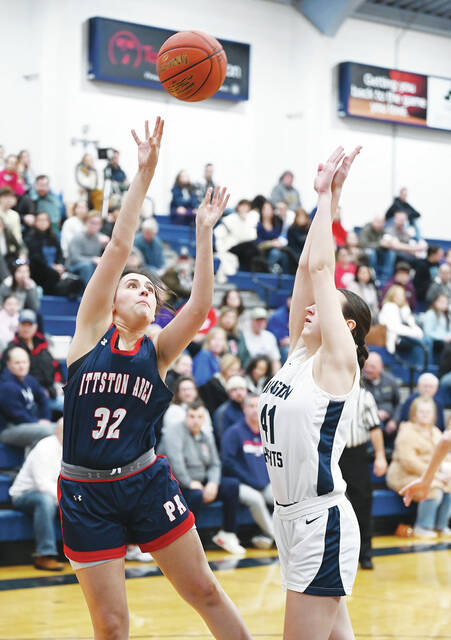 130399204_web1_PA-Abington-Heights-GBB-1
Pittston Area junior forward Grace Callahan (32) scores over Abington Heights Peyton Houlihan (41) in first-half action on Wednesday night.
Tony Callaio | For Times Leader
