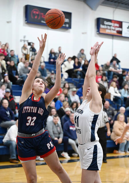 130406464_web1_PA-Abington-Heights-GBB-1
Pittston Area junior forward Grace Callahan (32) scores over Abington Heights Peyton Houlihan (41) in first-half action on Wednesday night at Abington.
Tony Callaio | For Sunday Dispatch