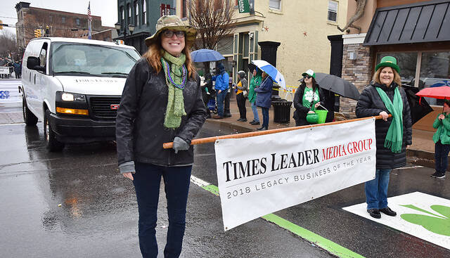 130425124_web1_Pittston-St.-Patrick-Parade-1
Times Leader Media Group Publisher Kerry Miscavage, left, and advertising director Diane McGee, carry the company banner during the Pittston St. Patrick Parade on Saturday.
Tony Callaio | For Times Leader