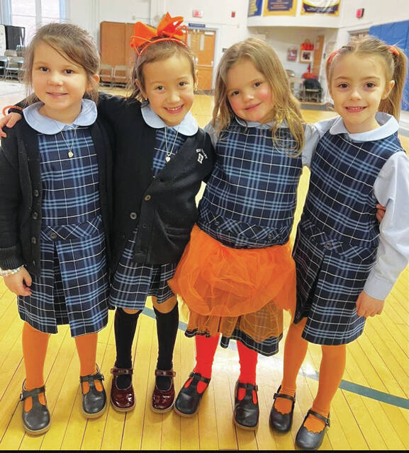 130459004_web1_image_6487327--5-
Kindergarten students Stella Dailey, Cheyenne Chofey, Karsyn Szumski, and Riley Ruda dress in orange on The Lorax day.