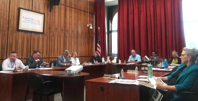 130646786_web1_council
Luzerne County Council members review a report during Tuesdays meeting.
Jennifer Learn-Andes | Times Leader