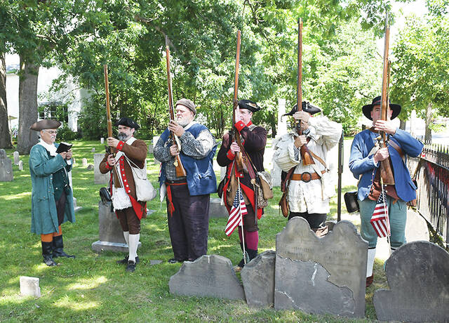 <p>Members of the 24th Connecticut Militia Regiment Revolutionary War Reenactors stage a solemn ceremony at the foot of graves of Benjamin and Stuckley Harding, who died on June 30, 1778 at the hands of the Indians from this 2022 file photo.</p>