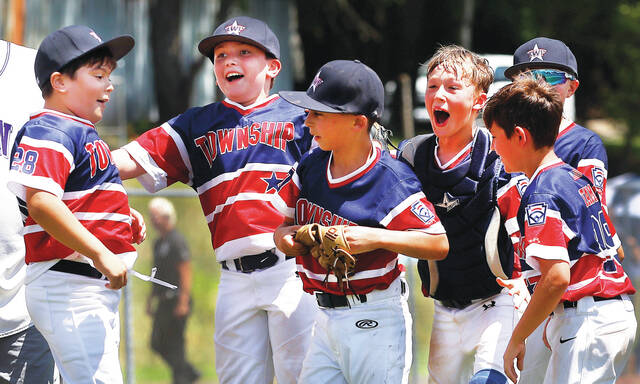 130739701_web1_twp2_faa
Township players celebrate their 7-6 win over Plains on Saturday for the District 16 8-10 Baseball championship.
Fred Adams | For Times Leader