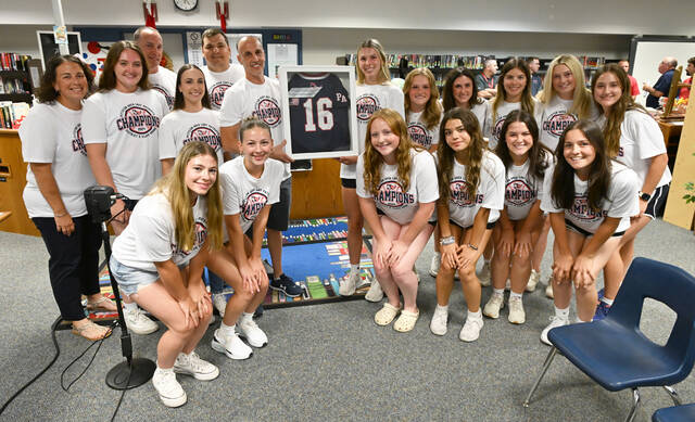 130773732_web1_PA-Softball-Team-Honored-5
The Pittston Area Patriots varsity softball team was honored by the school board prior to the start of the July meeting. Superintendent Kevin Booth annouced 2024 graduate and all-star pitcher Gianna Adams (holding the display) would have her number retired and put on permanent display at the high school. The team is shown with the coacing staff, including head coach Frank Parente (holding the jersey display to Adams right). The 2024 team was edged out of the PIAA 5A State Championship game in extra innings at Penn State University in June.
Tony Callaio | For Sunday Dispatch