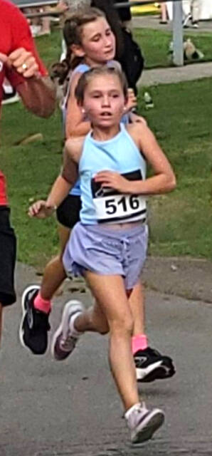 130806226_web1_Natalie-Ruggles-Race-1
Natalie Ruggles, 8, of West Pittston, crosses the finish line at the Jack Daniels Mile Run at Tunkhannock taking the top spot in the 8-and-under category out of 22 runners. She broke the course record for her age bracket with a personal best run of 7:11.
Submitted Photo