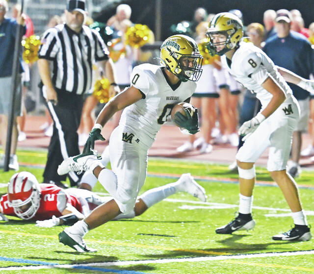130856112_web1_WA-Crestwood-ftbl-6
Trustin Johnson scores a 9-yard touchdown for Wyoming Area to go up 14-7 late in the third quarter against Crestwood.
Tony Callaio | For Times Leader