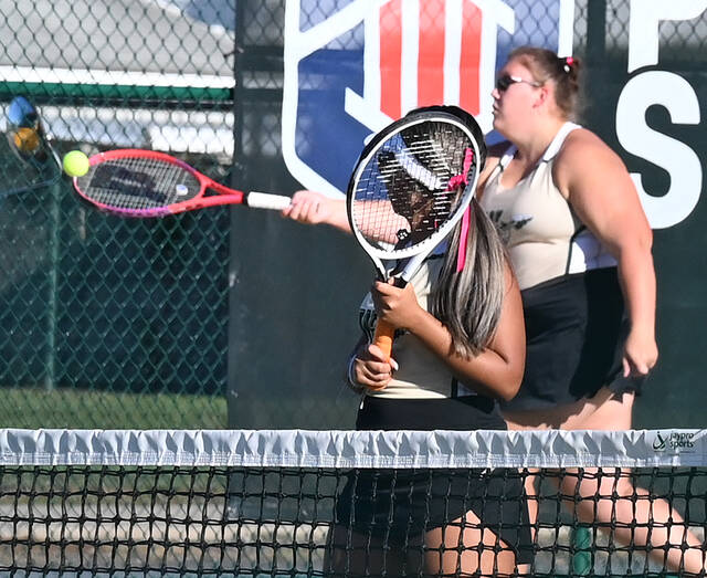 130963794_web1_WA-Dallas-GTNS-6
Wyoming Area doubles partner Selena Nova, near, watches Erica Gilligan return a serve against Dallas Areas No.1 doubles team. Wyoming Area won the quarterfinal district match 3 - 2 on the racquets of Gilligan/Nova, 3-6, 6-2, 7-5.
Tony Callaio | For Sunday Dispatch
