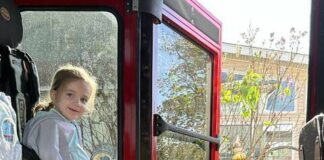 
			
				                                Grace Serafin is delighted to sit in a real firetruck, assisted by Assistant Fire Chief David Granteed.
                                 Submitted Photo

			
		